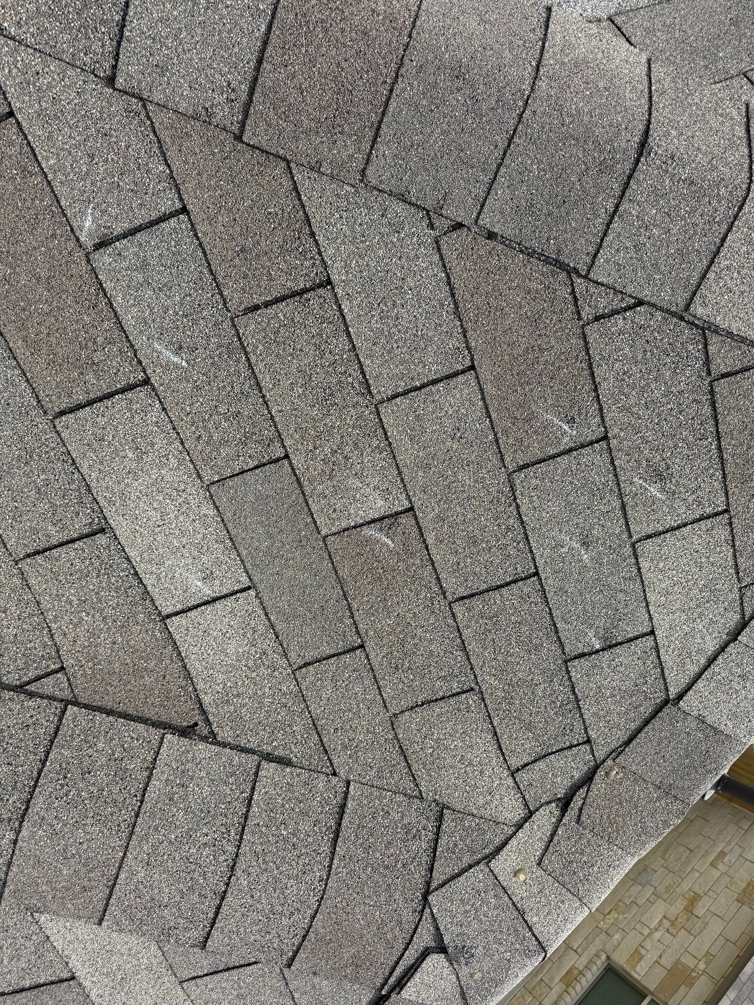 A close up of a roof with shingles on it.