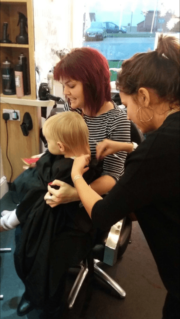 Kid getting a hair cut