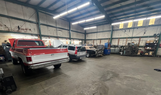 A large, well-lit auto repair shop. | Maynard's Auto Repair Service