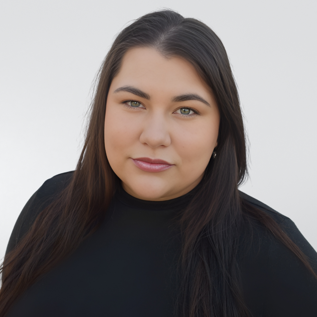 A woman with long hair is wearing a black turtleneck