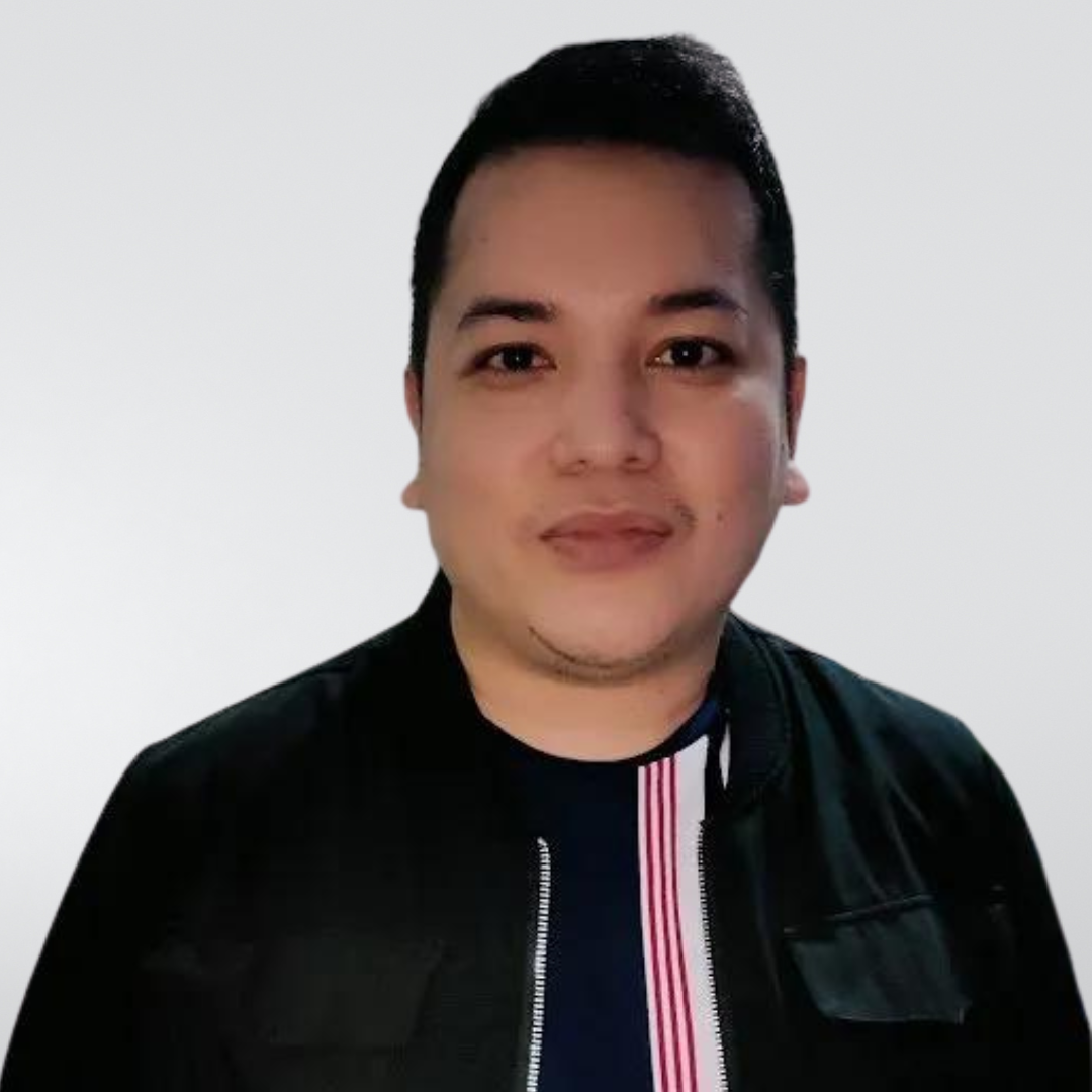 A man is wearing a black jacket and a striped shirt