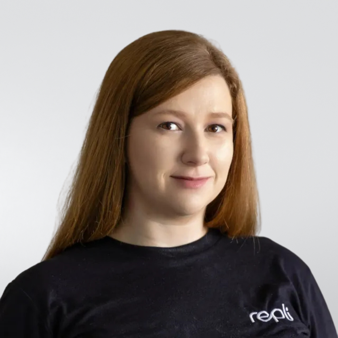 A woman wearing a black t-shirt with the word reali on it.