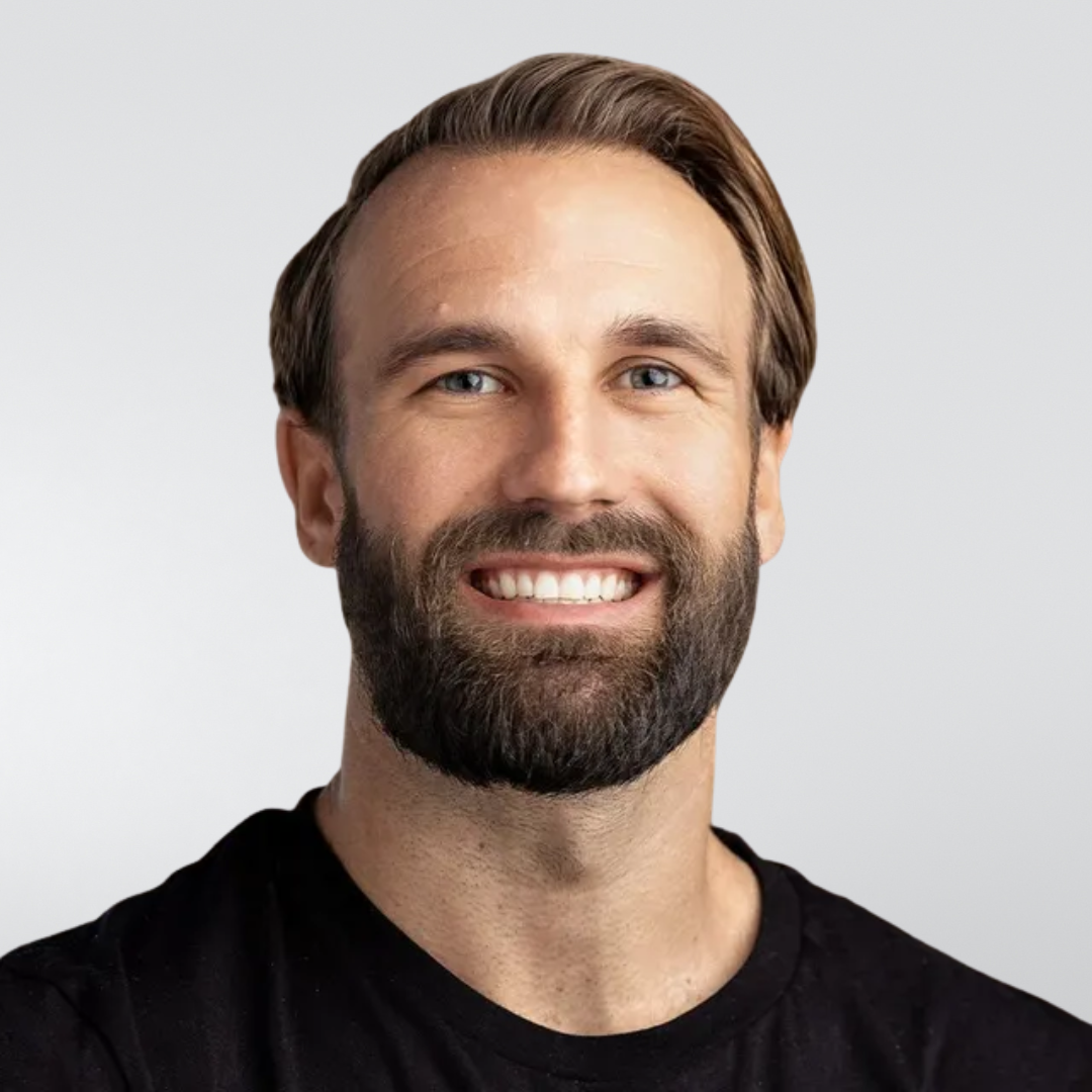 A man with a beard is wearing a black t-shirt that says repli