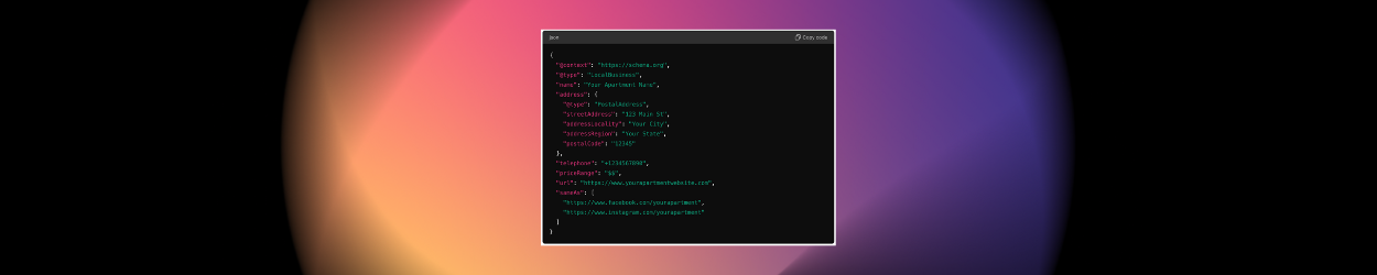 A blurred image of a computer screen with a purple and pink background.
