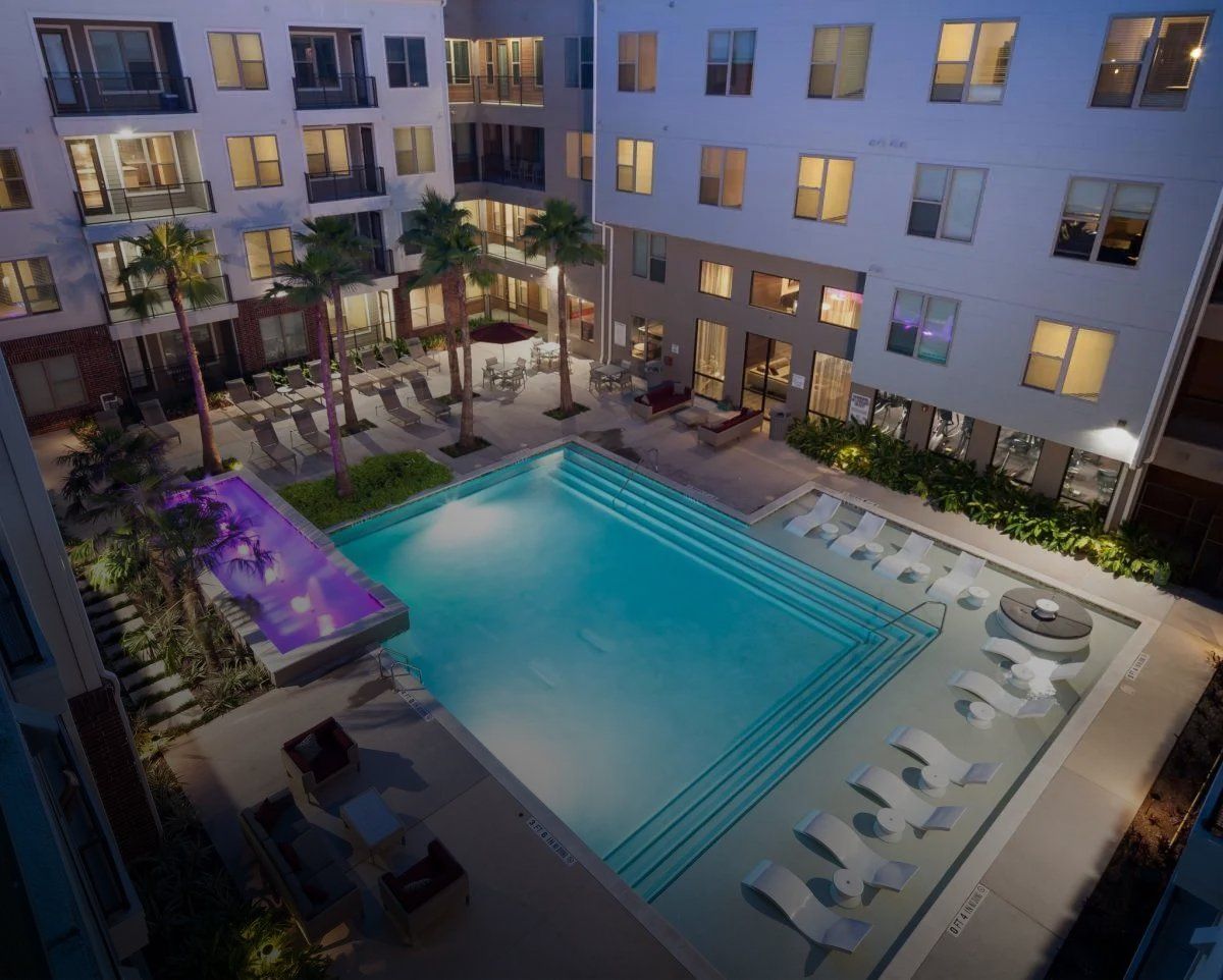 An aerial view of a large swimming pool in the middle of a building