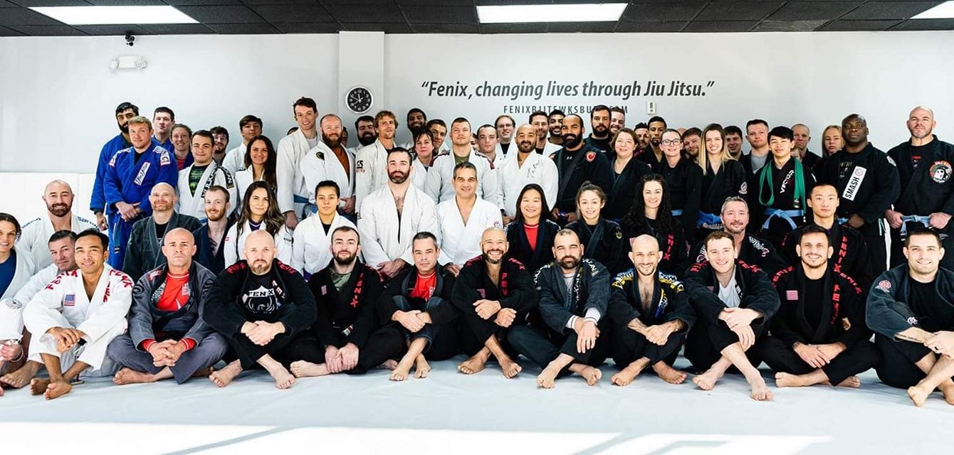 A large group of people posing for a picture at Fenix Brazilian Jiu Jitsu