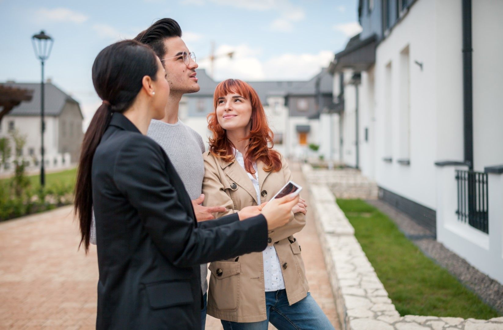 Homebuyers visiting a property with a realtor