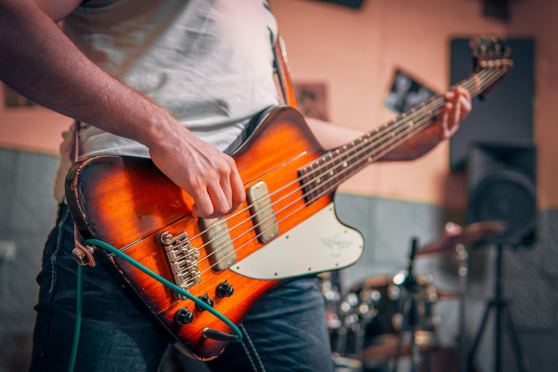 A man is playing an electric guitar on stage.