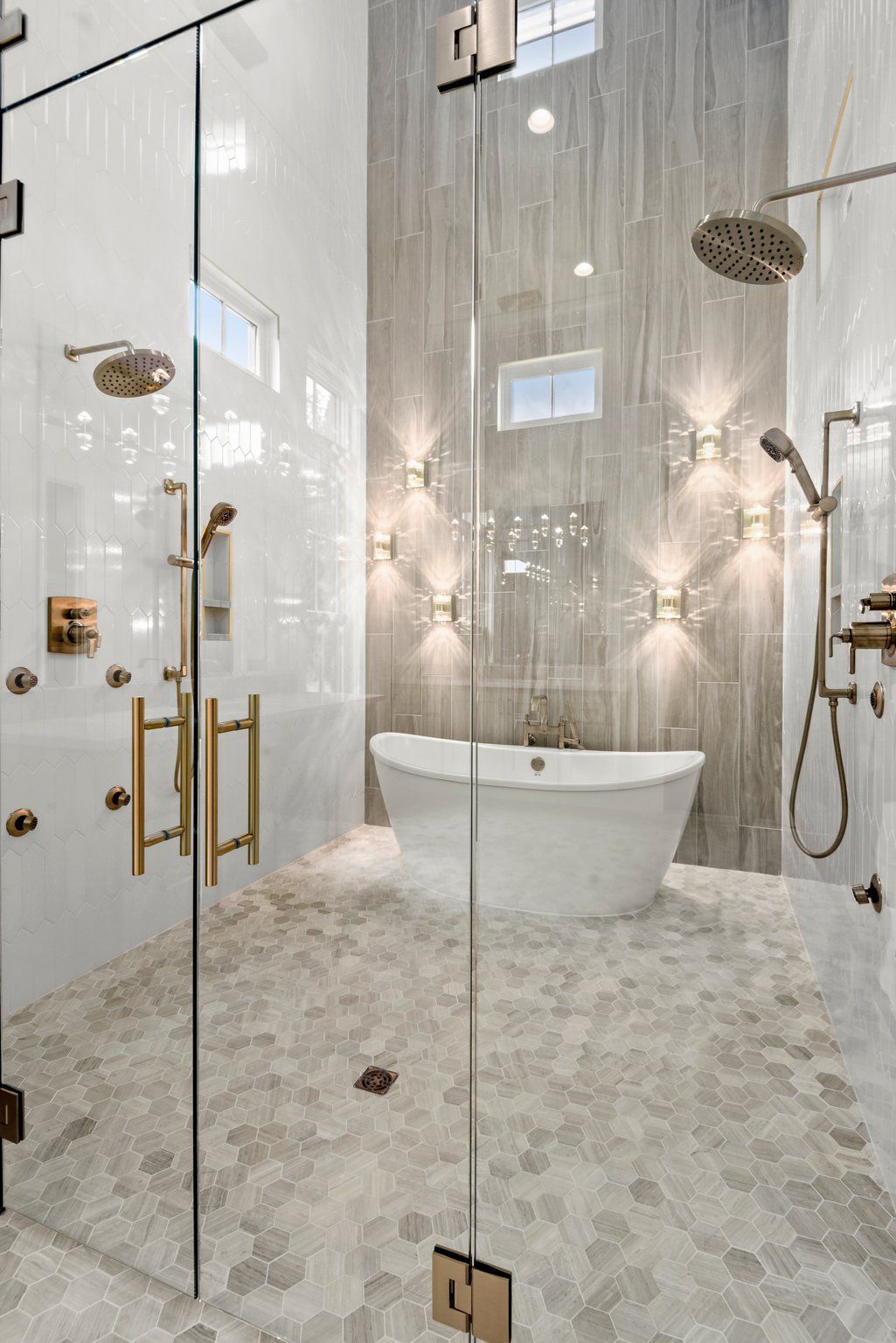 A bathroom with a bathtub and a walk in shower.