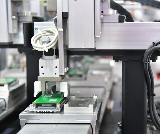 an automated machine handling a PCB