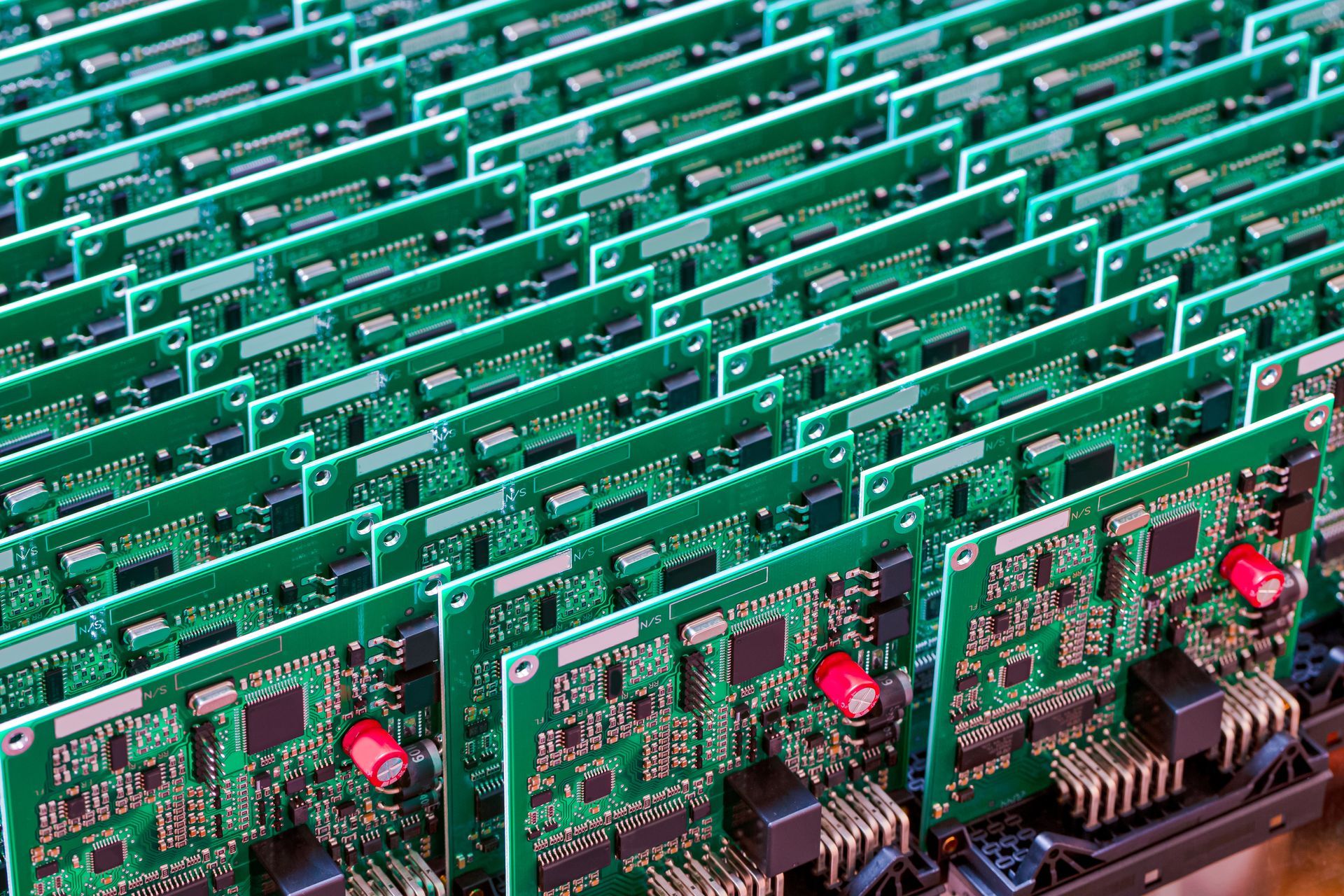Rows of green circuit boards densely packed with components.