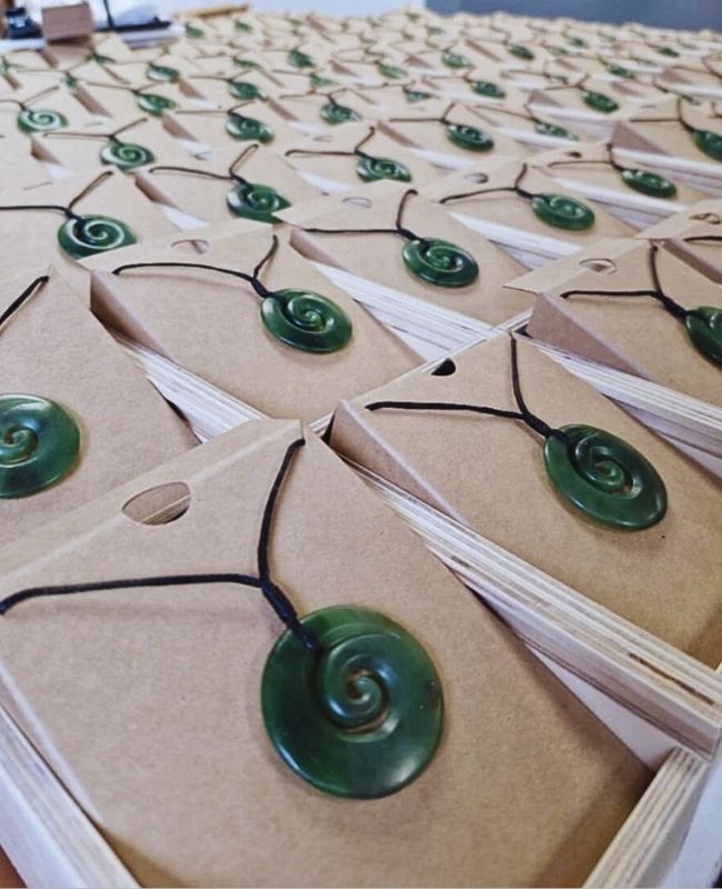 Pounamu koru pendants for conference attendees