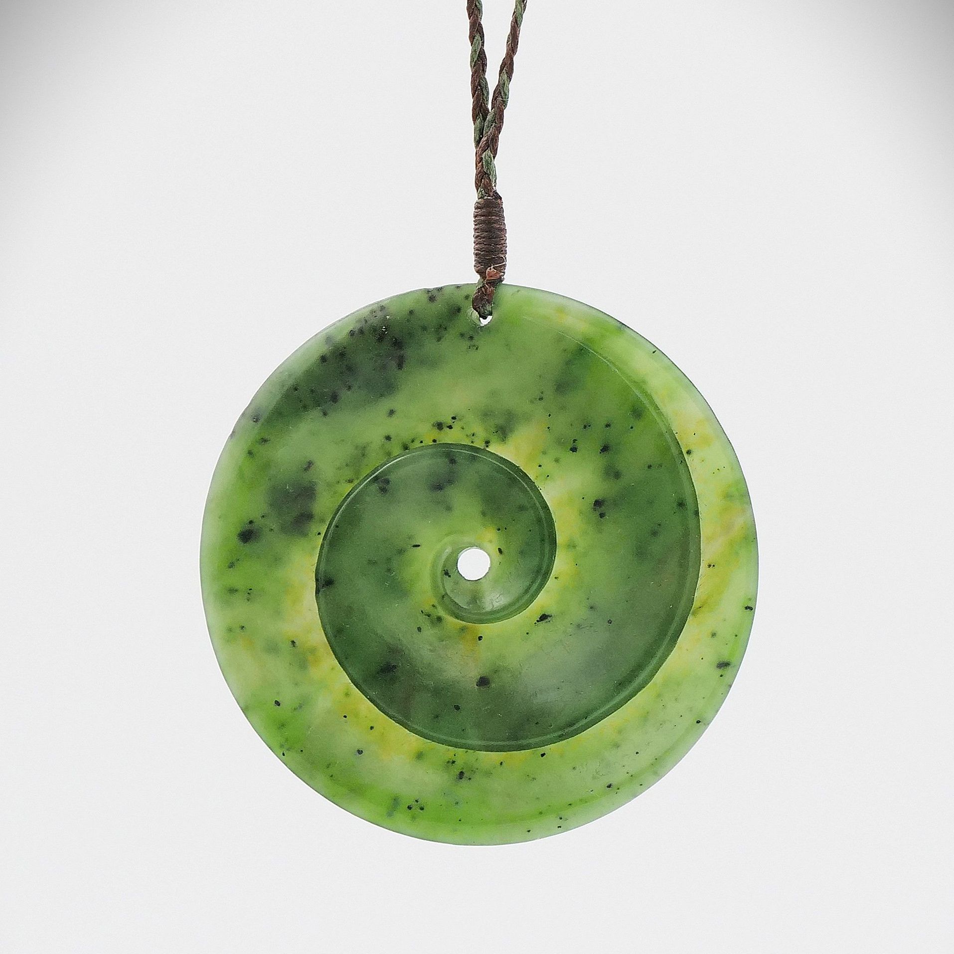 A greenstone koru  pendant 