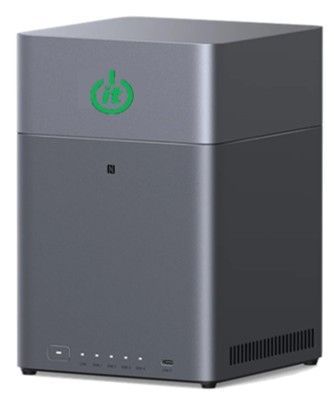 Gray tower-shaped device with a green power symbol on top, a small black dot below it, and a row of buttons on the bottom.