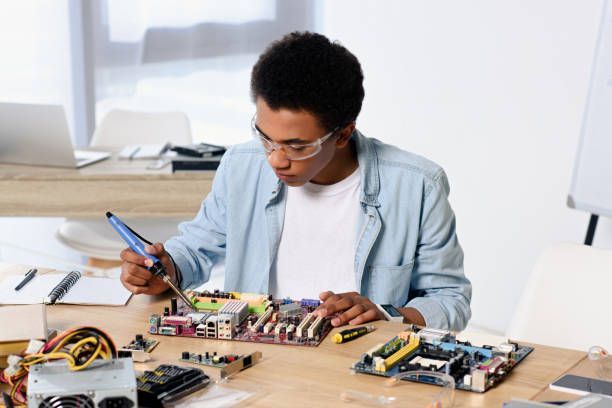Picture of a technician performing computer repair services on a motherboard