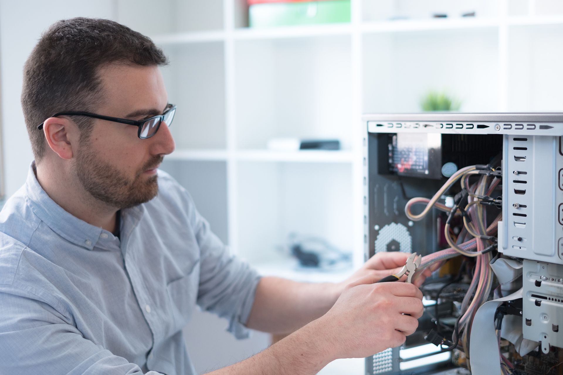 A man is performing diagnostics as part of professional computer repair services.