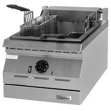 Commercial stainless steel deep fryer with basket and temperature controls.