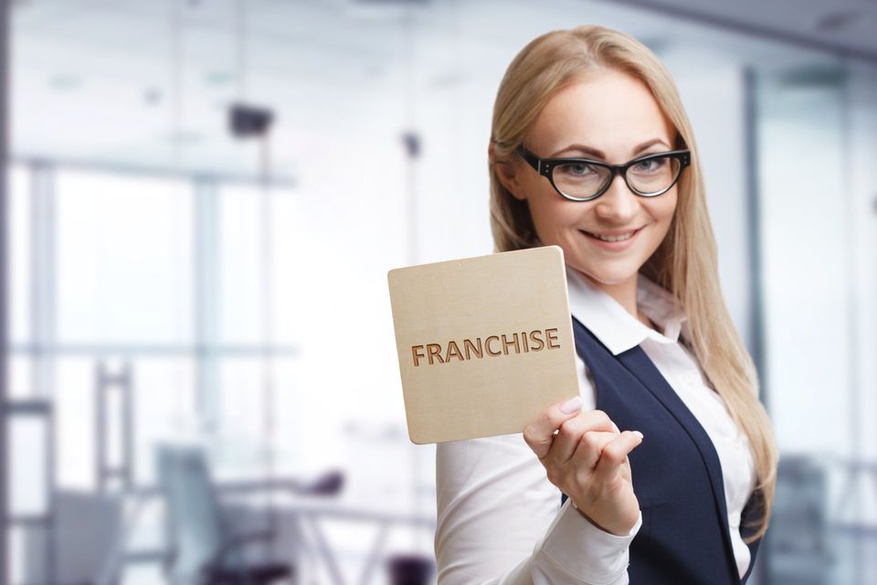 business person explaining how to grow a franchise business
