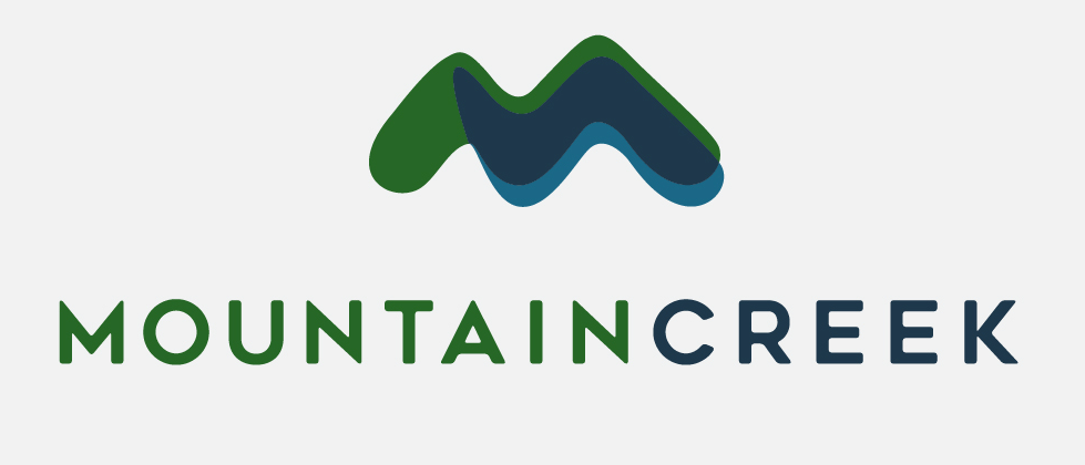 Mountain Creek logo: green and blue mountain range over the words 