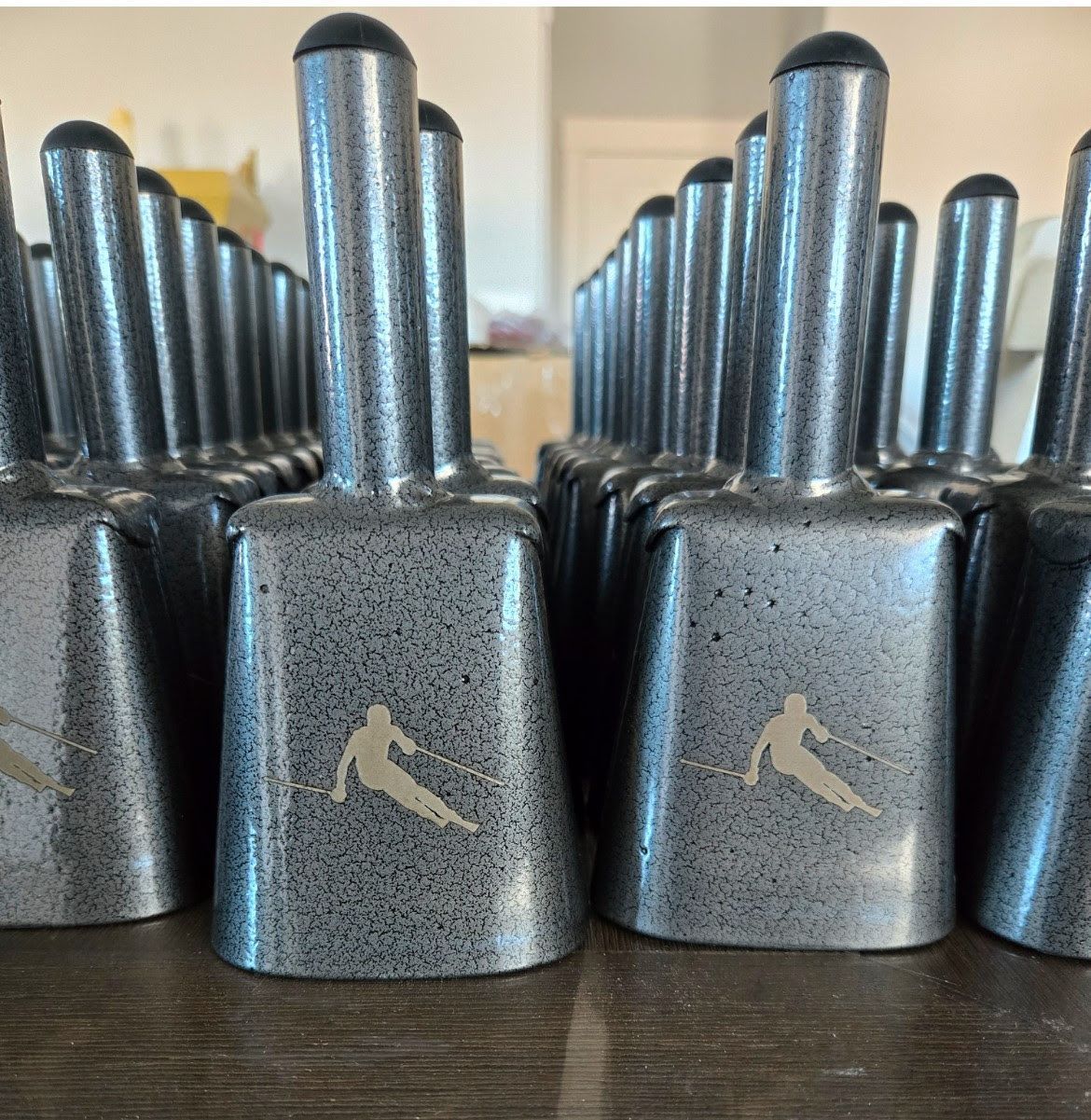 Red puffy winter jacket with a hood, front and back views. Features a small logo on the front.