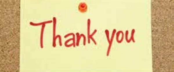 Yellow sticky note with red handwritten words 