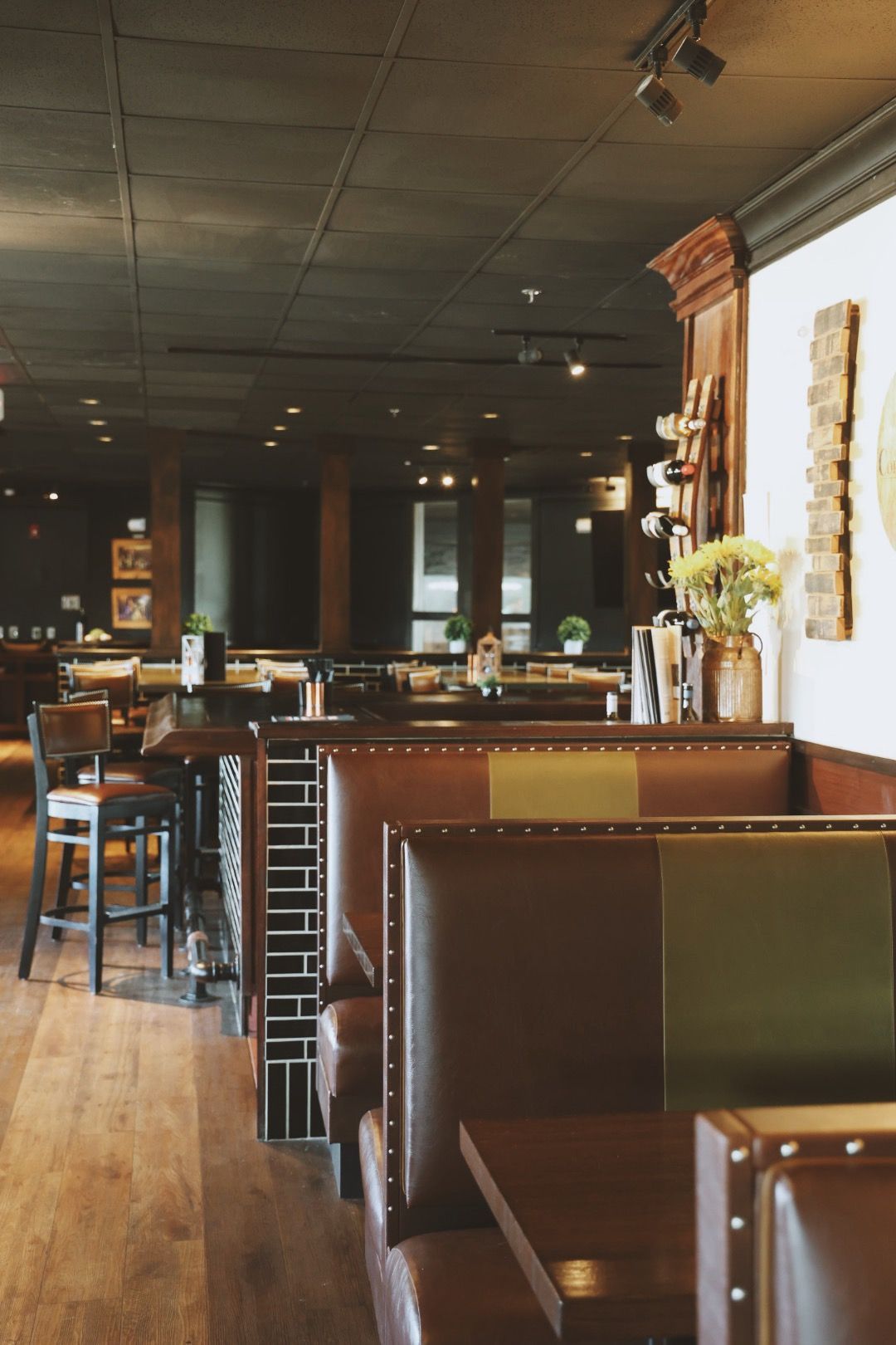 A restaurant with a lot of booths and tables