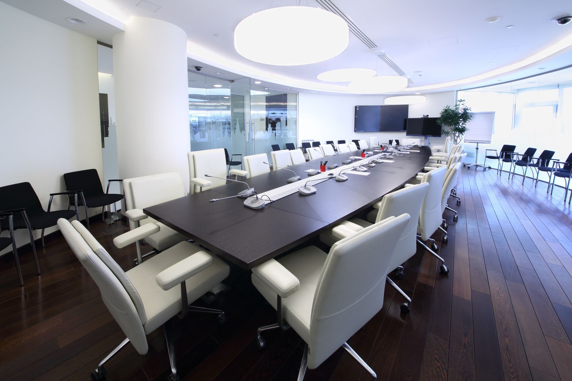 A conference room with a long table and chairs