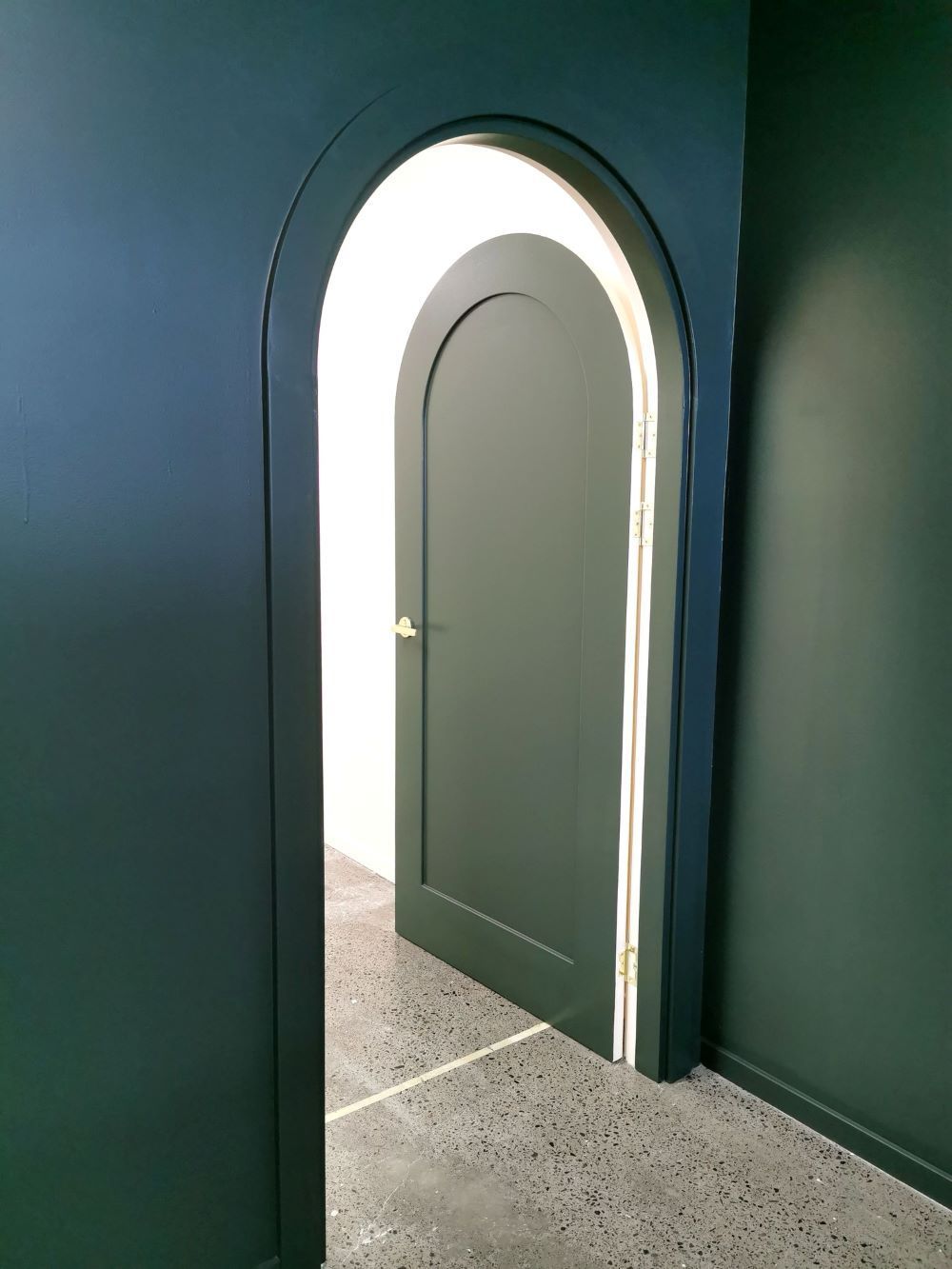 A Door With an Arch in the Middle of a Room — Eva Professional Painting in Nerang, QLD