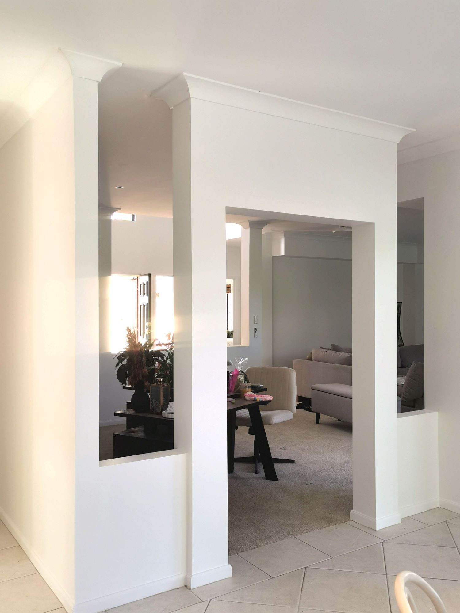 A Living Room With a Table and Chairs and a Dining Room — Eva Professional Painting in Nerang, QLD