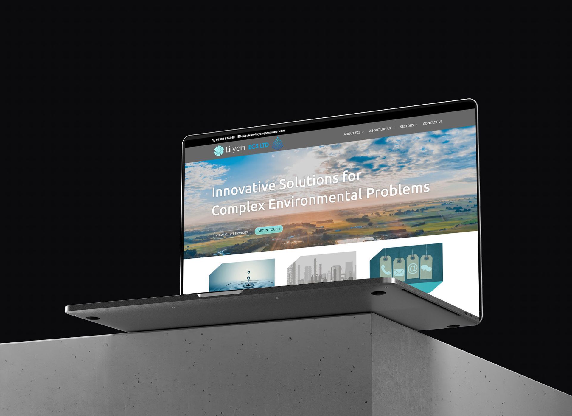 A laptop screen shows a website for forklift truck batteries