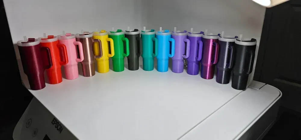 A circle of plastic cups of different colors on a table