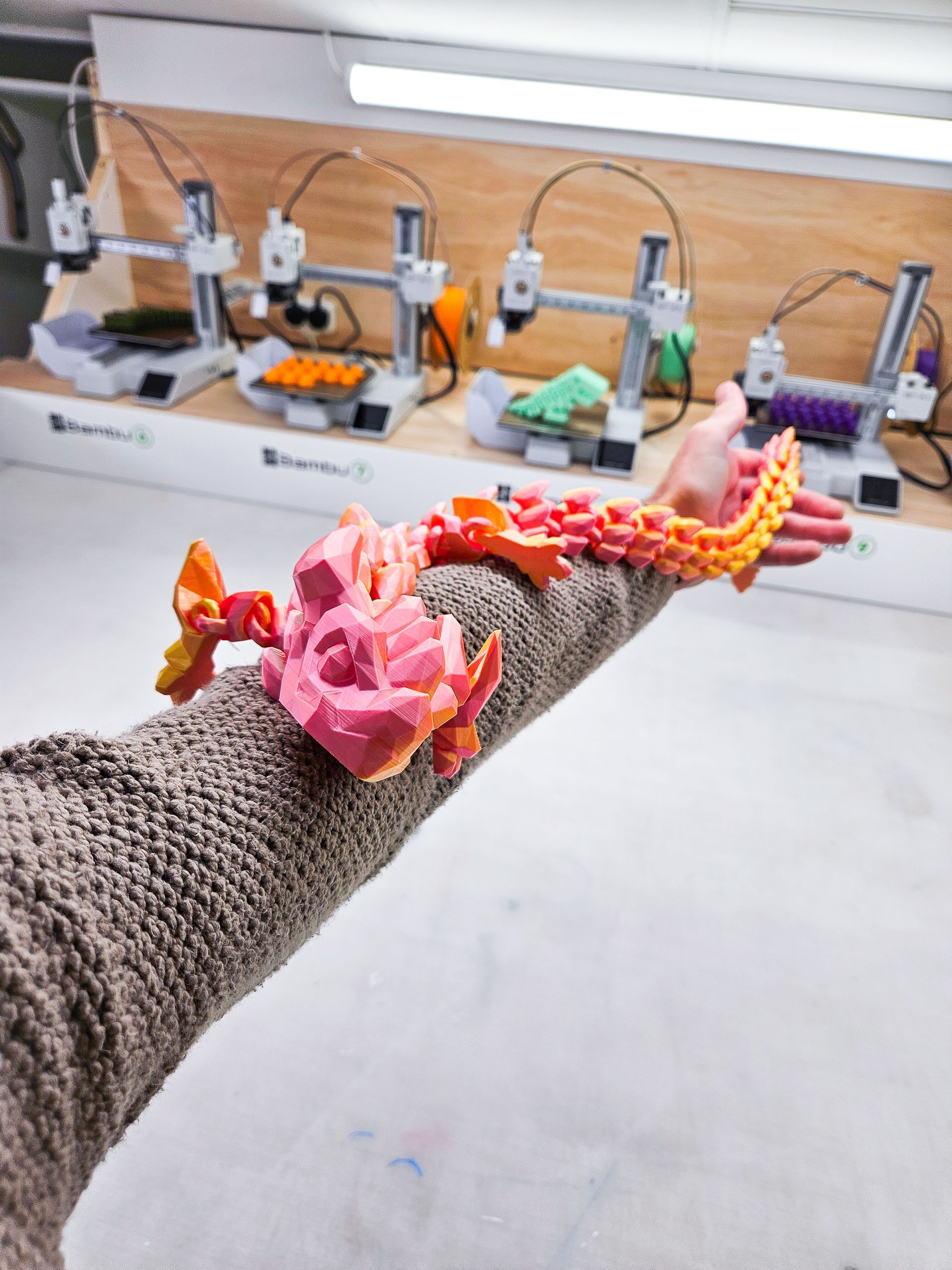 A 3d printed model of a dinosaur skeleton on a white background.