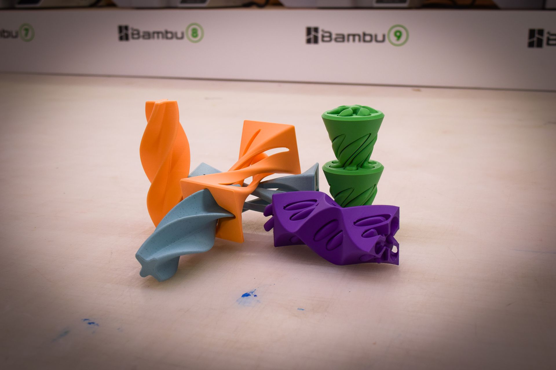 A group of colorful 3d printed objects on a white background