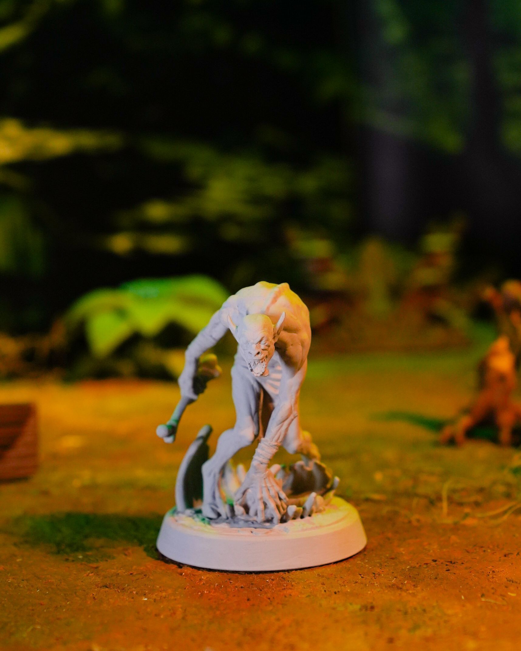 A statue of a monster crawling on the ground