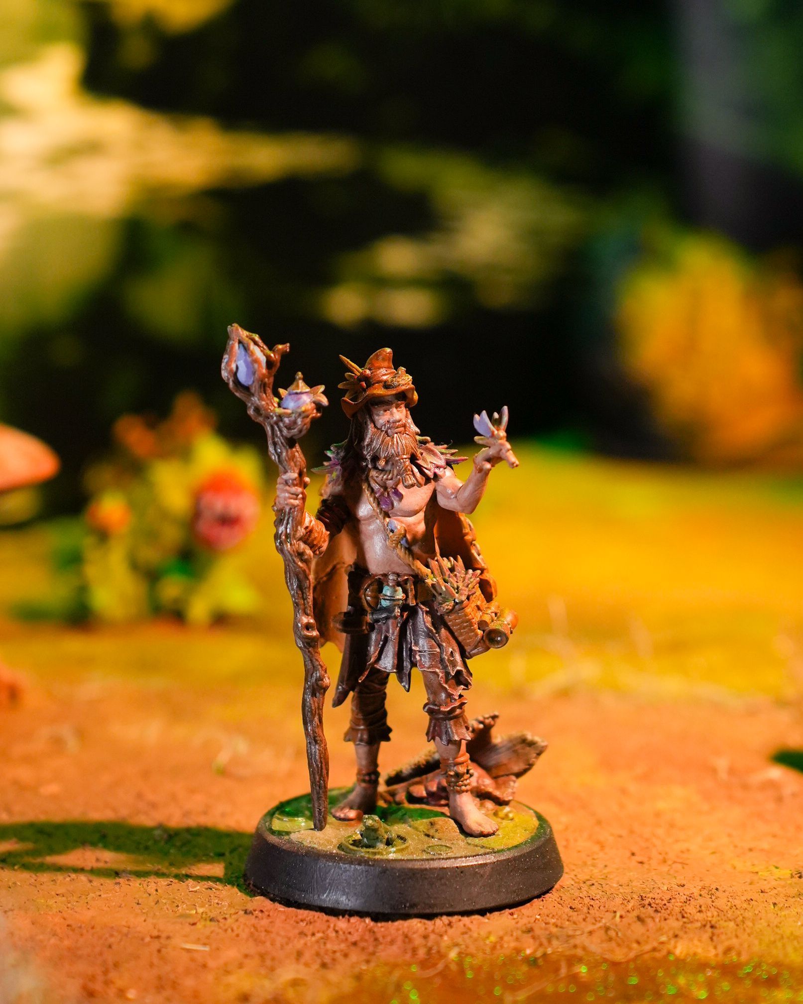 A statue of a man with a beard holding a cane.