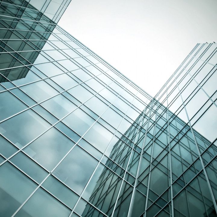 Glass Buildings With Cloudy Blue Sky