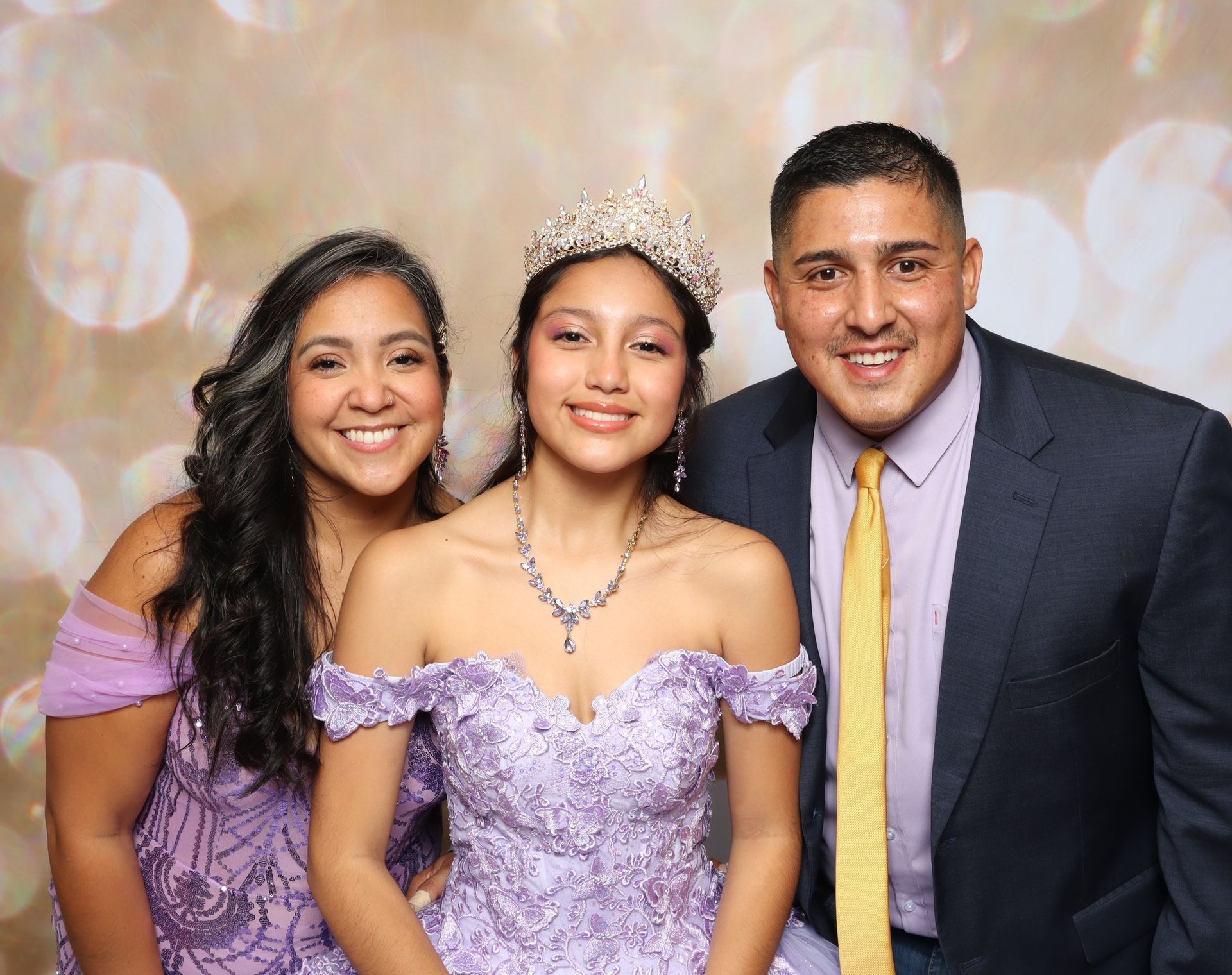 San Antonio party guests posing in open-air printed photo booth setup