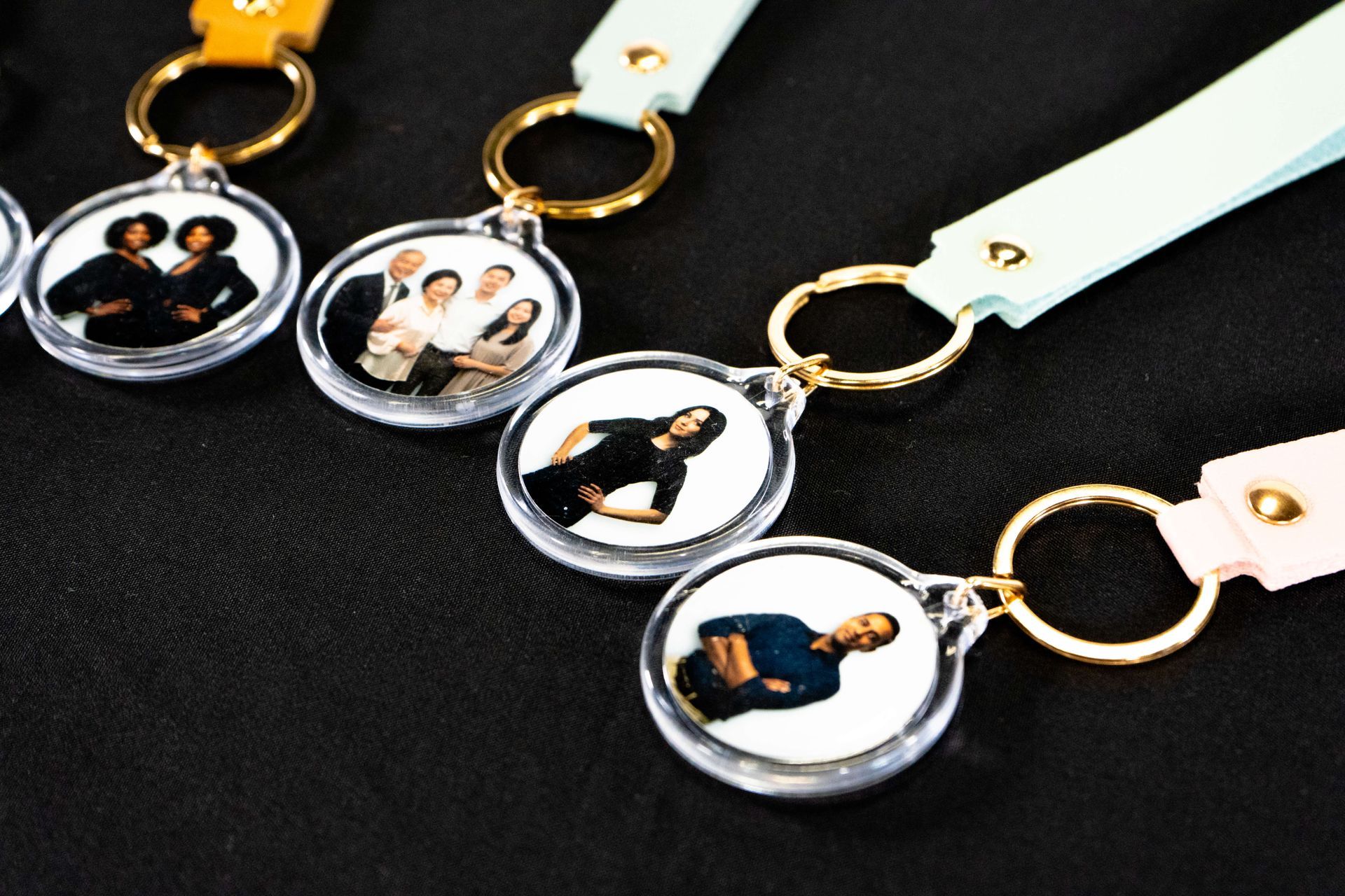 Custom photo keychain wedding favors featuring personalized portraits, elegant leather straps, and gold key rings displayed on a black background — a unique, keepsake guest favor option for weddings and special events.