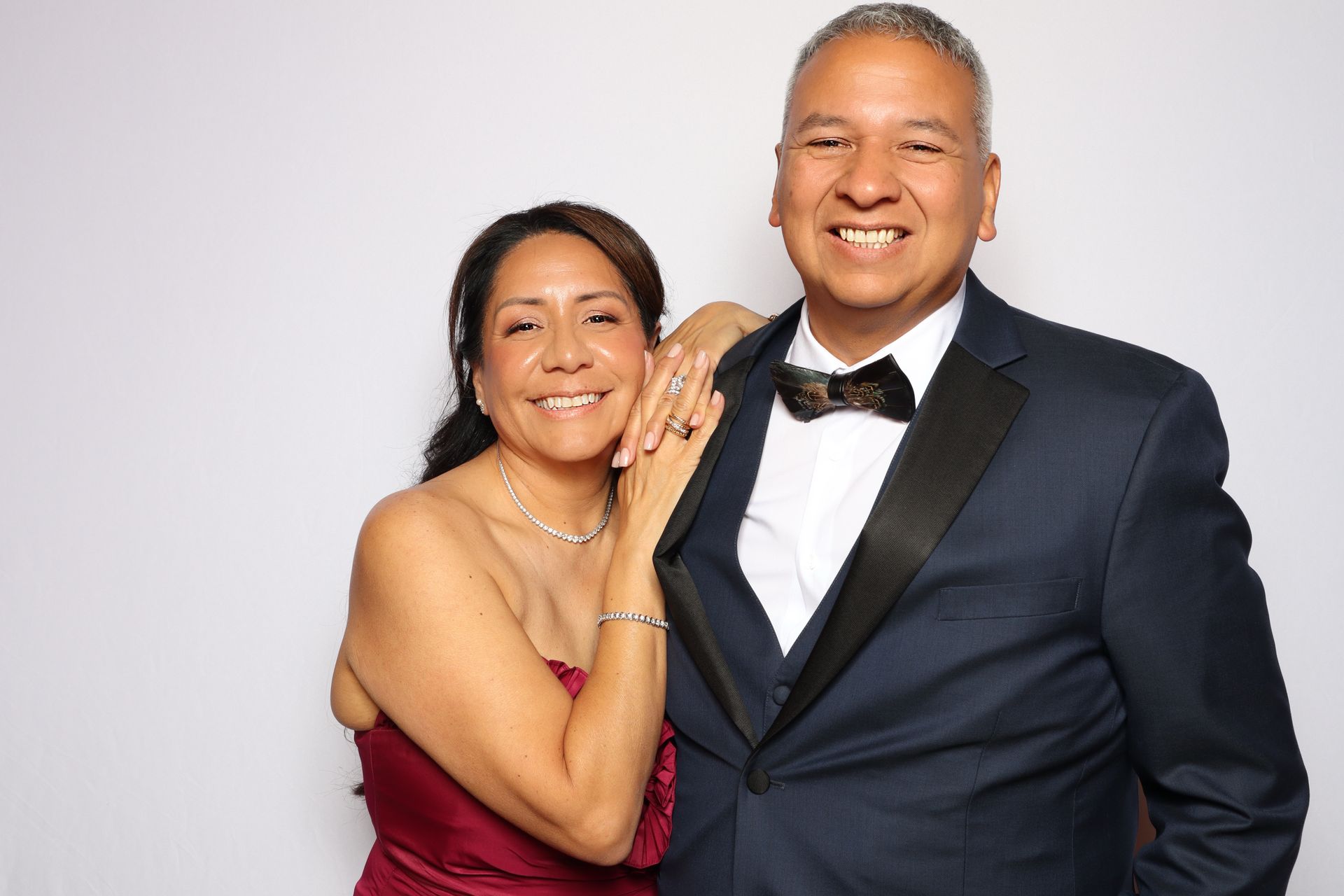Wedding guests enjoying open-air photo booth during reception