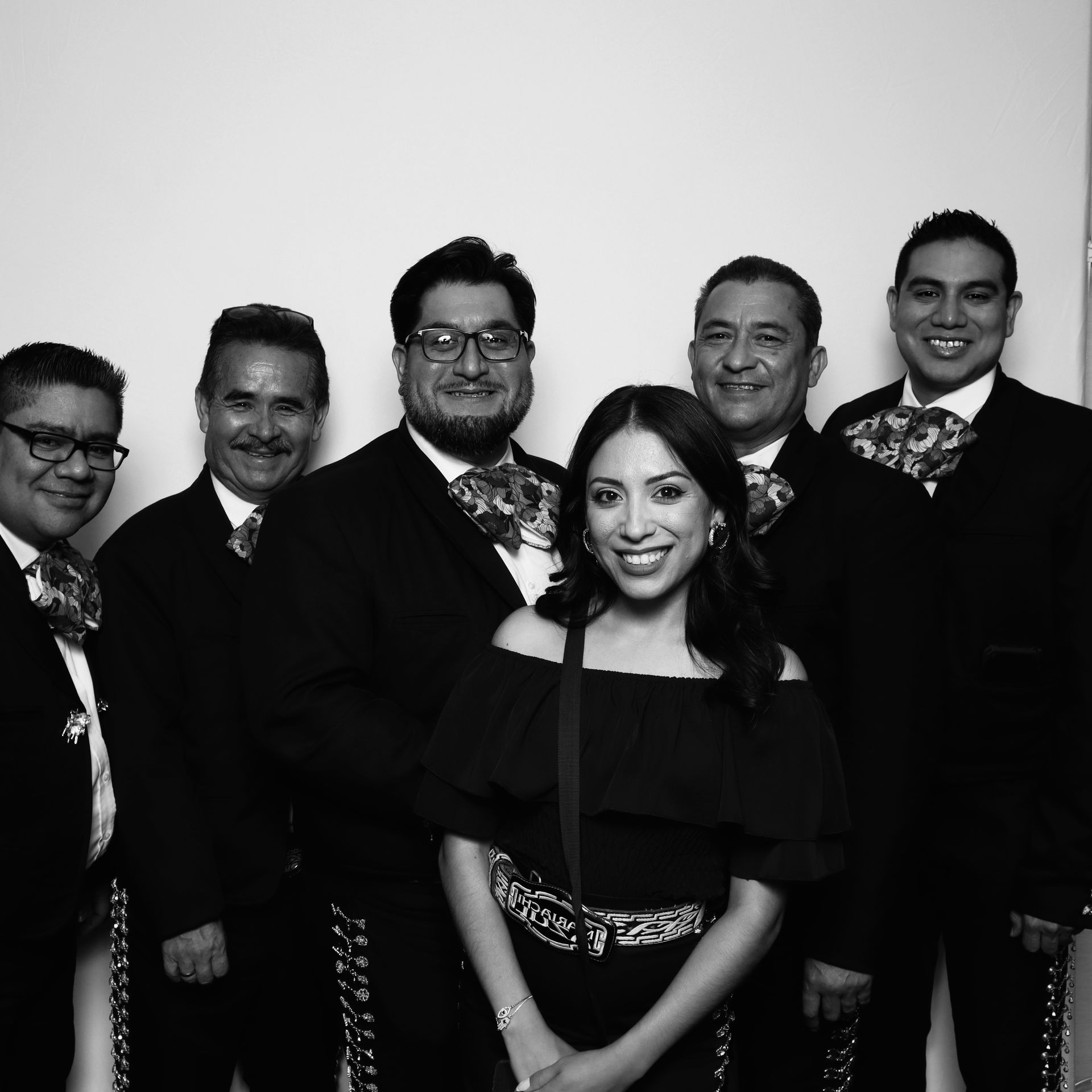 Corporate event attendees enjoying black and white glam booth activation