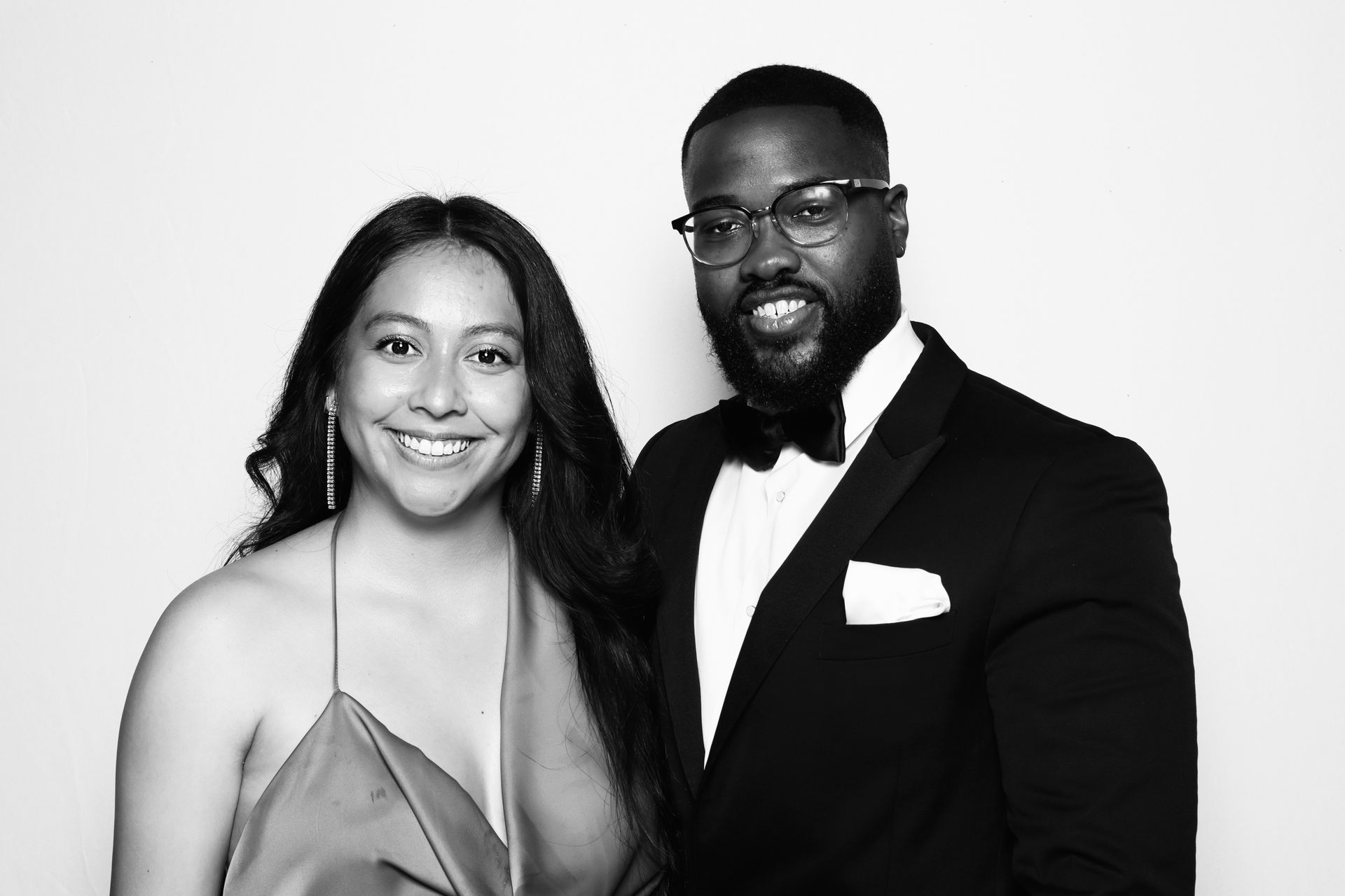 Corporate event attendees enjoying black and white glam booth activation