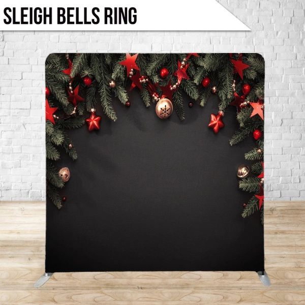 A sleigh bells ring with christmas decorations on a black background