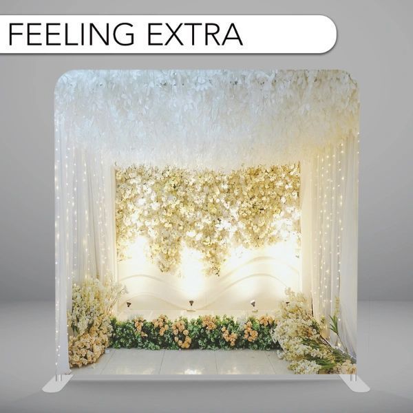 A picture of a wedding backdrop that says feeling extra
