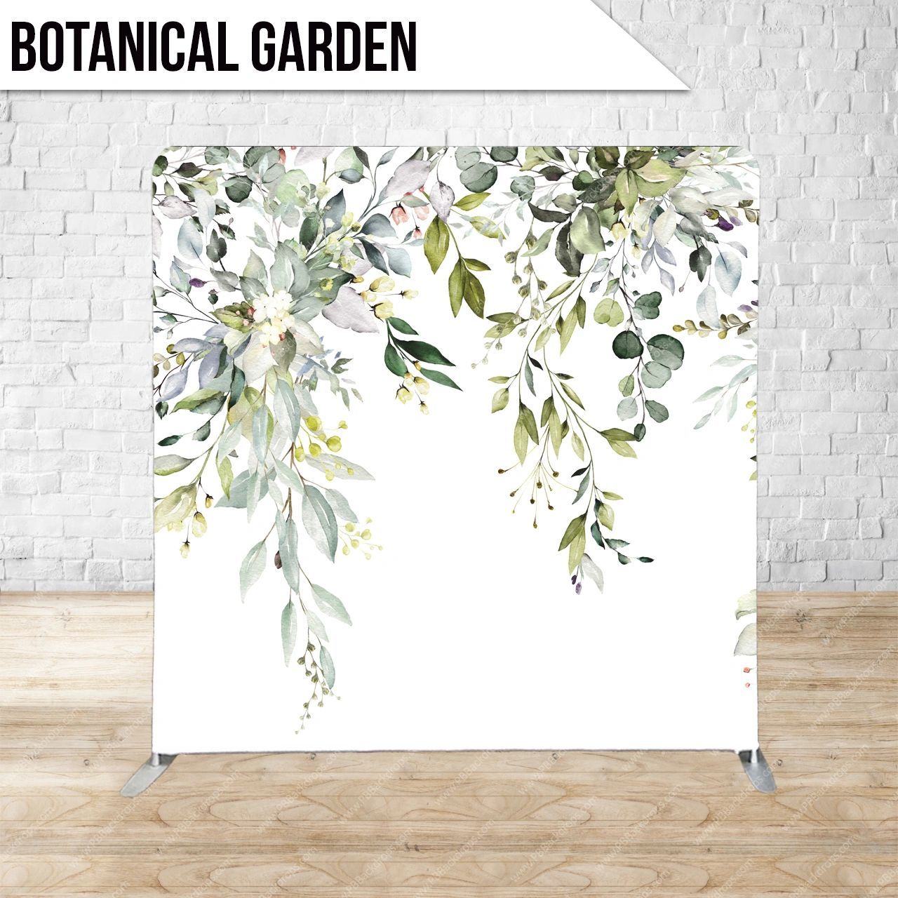 A botanical garden backdrop is sitting on a wooden floor in front of a brick wall.