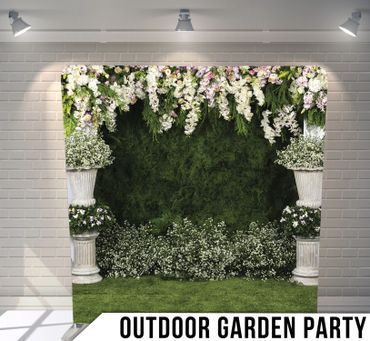 An outdoor garden party with flowers hanging from the ceiling