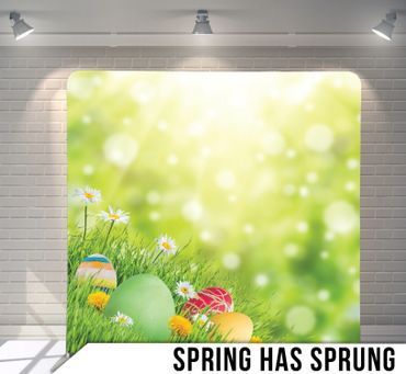 A poster that says spring has sprung with easter eggs in the grass