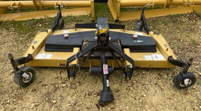 Yellow rotary mower with wheels, attached to a tractor.