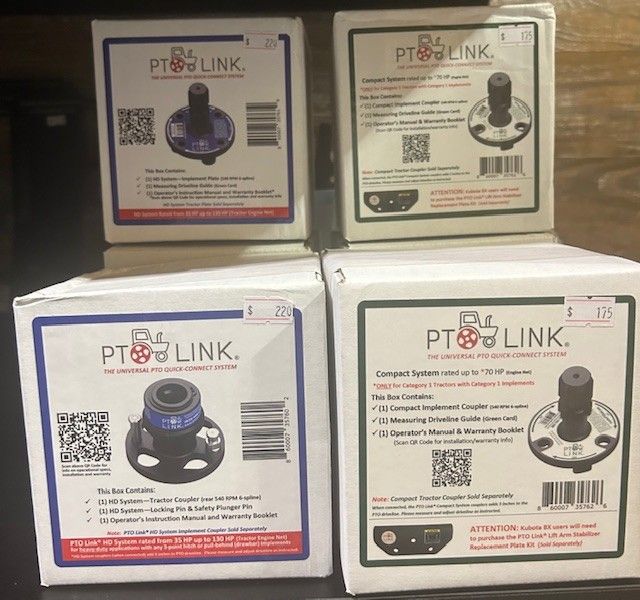 Four boxes of PTO Link couplers. Boxes are white with black and blue text and graphics.