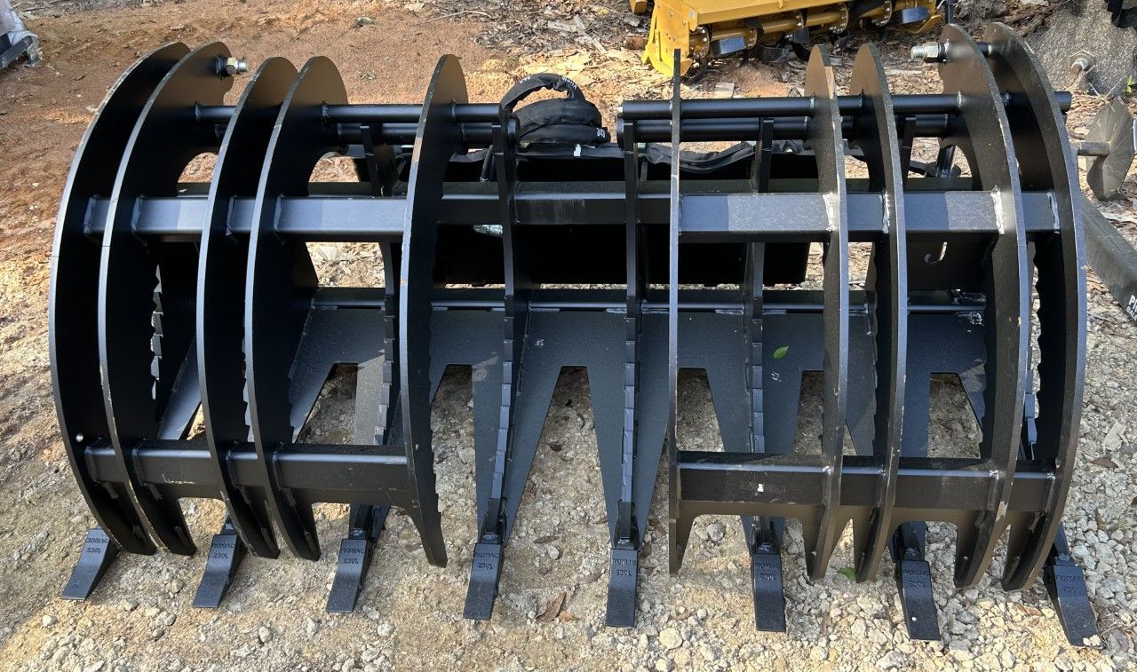 Black grapple attachment for a piece of heavy machinery.