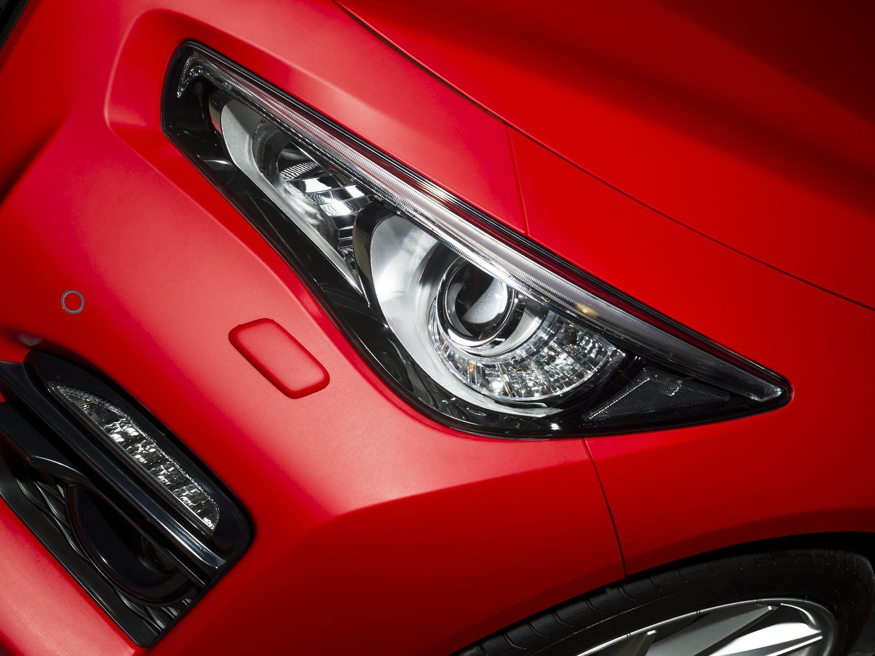 A close up of water drops on the hood of a car